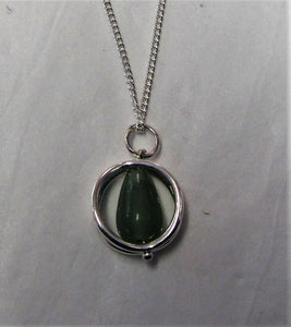 Beautiful handcrafted sterling silver necklace and round cage with Jade pendant