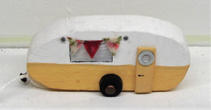 Beautiful handcrafted wooden caravans in various colours