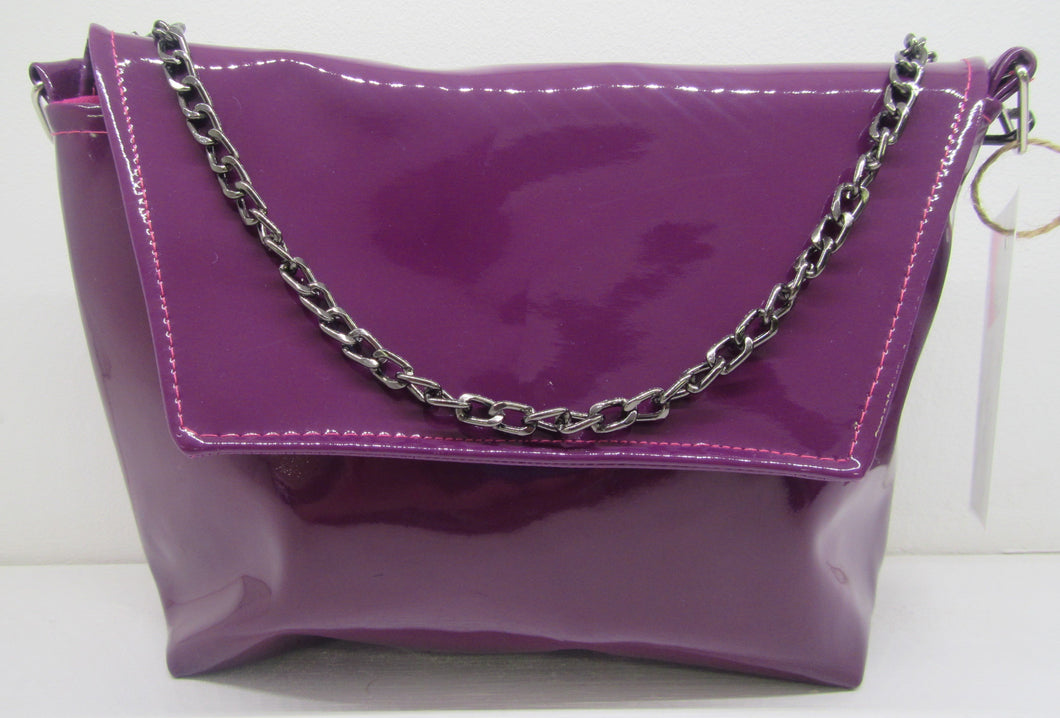 Beautiful handcrafted purple flux fur leather clutch bag