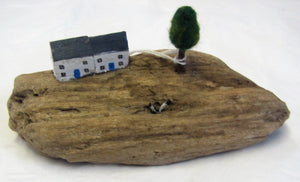 Beautiful handcrafted wooden "cottage on driftwood