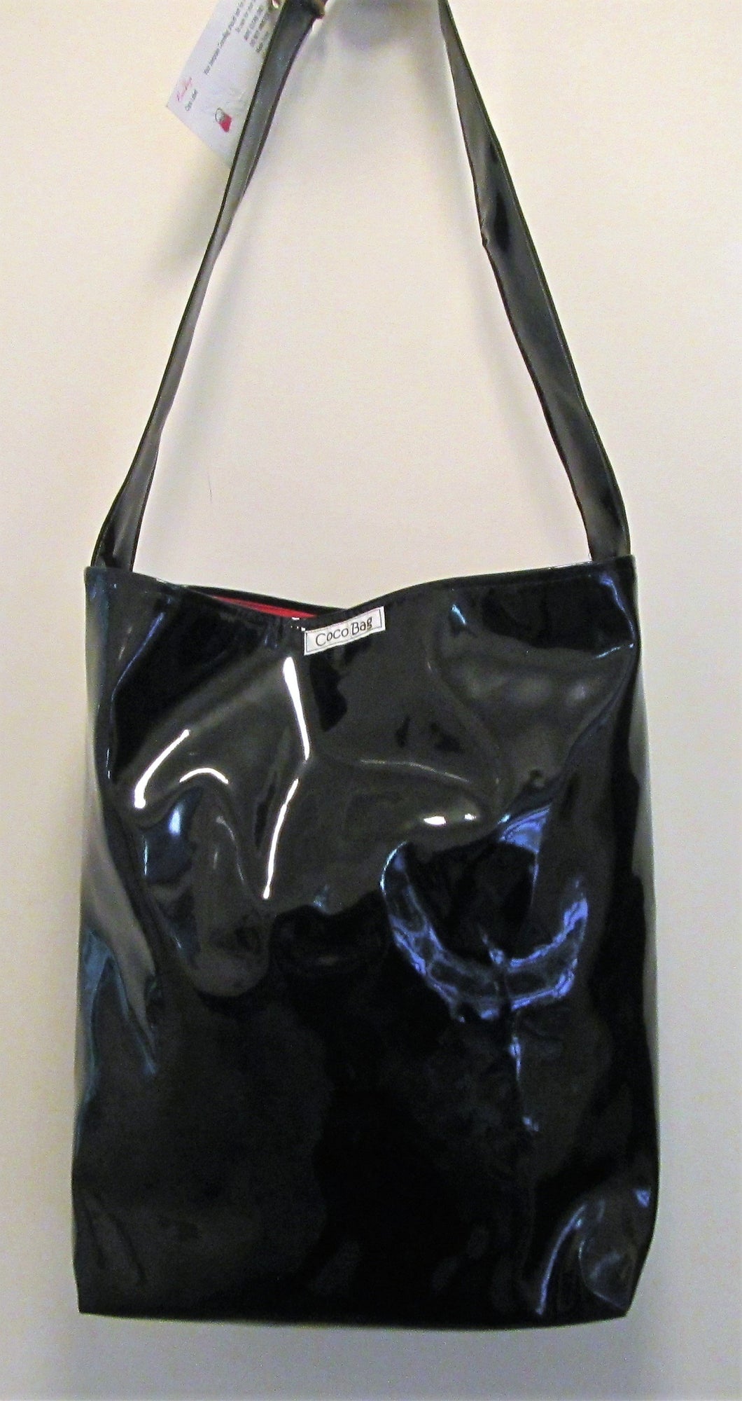 Beautiful handcrafted black patent handbag with one handle