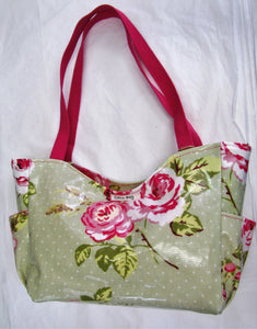 Beautiful handcrafted Pink and green floral wax fabric handbag with two pink handles