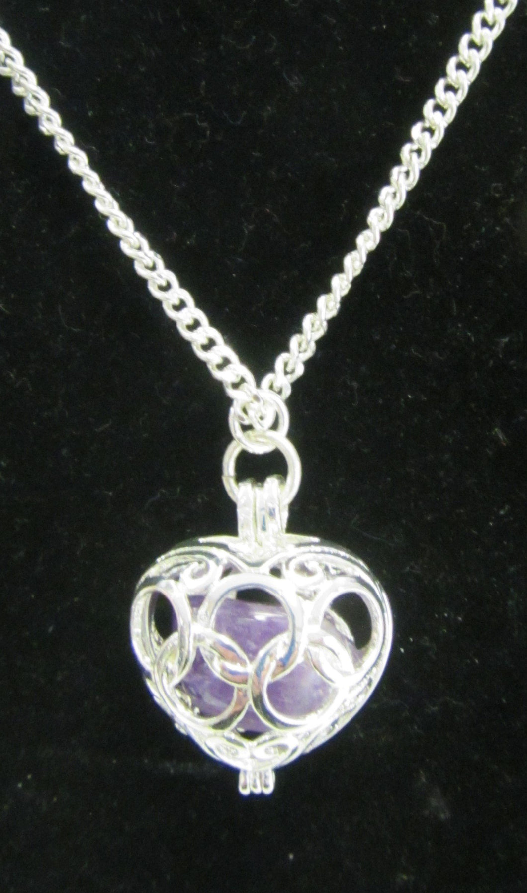 Beautiful handcrafted silver plated necklace with amethyst stone enclosed in the heart