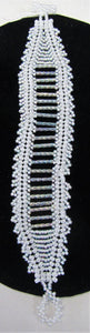 Beautiful handcrafted bracelet with white beads, fastened with a toggle clasp