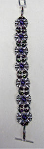Beautiful handcrafted bracelet with purple and silver beads, fastened  with a toggle clasp