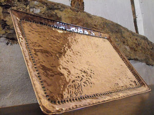 An Arts and Crafts Hammered Copper Tray by John Pearson